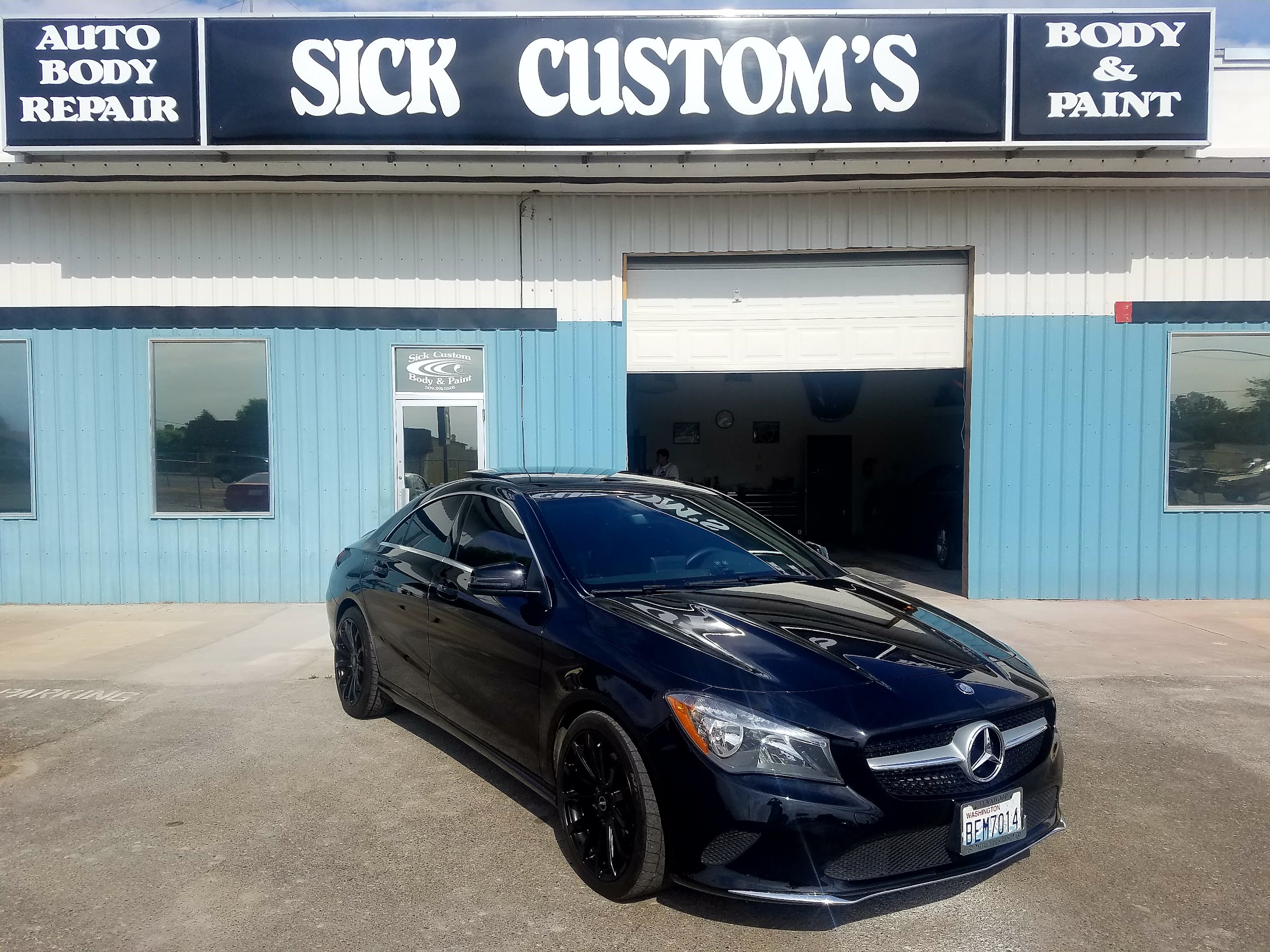The Sick Custom Collision Repair storefront in Sunnyside, Washington, with a customer's Mercedes parked out front