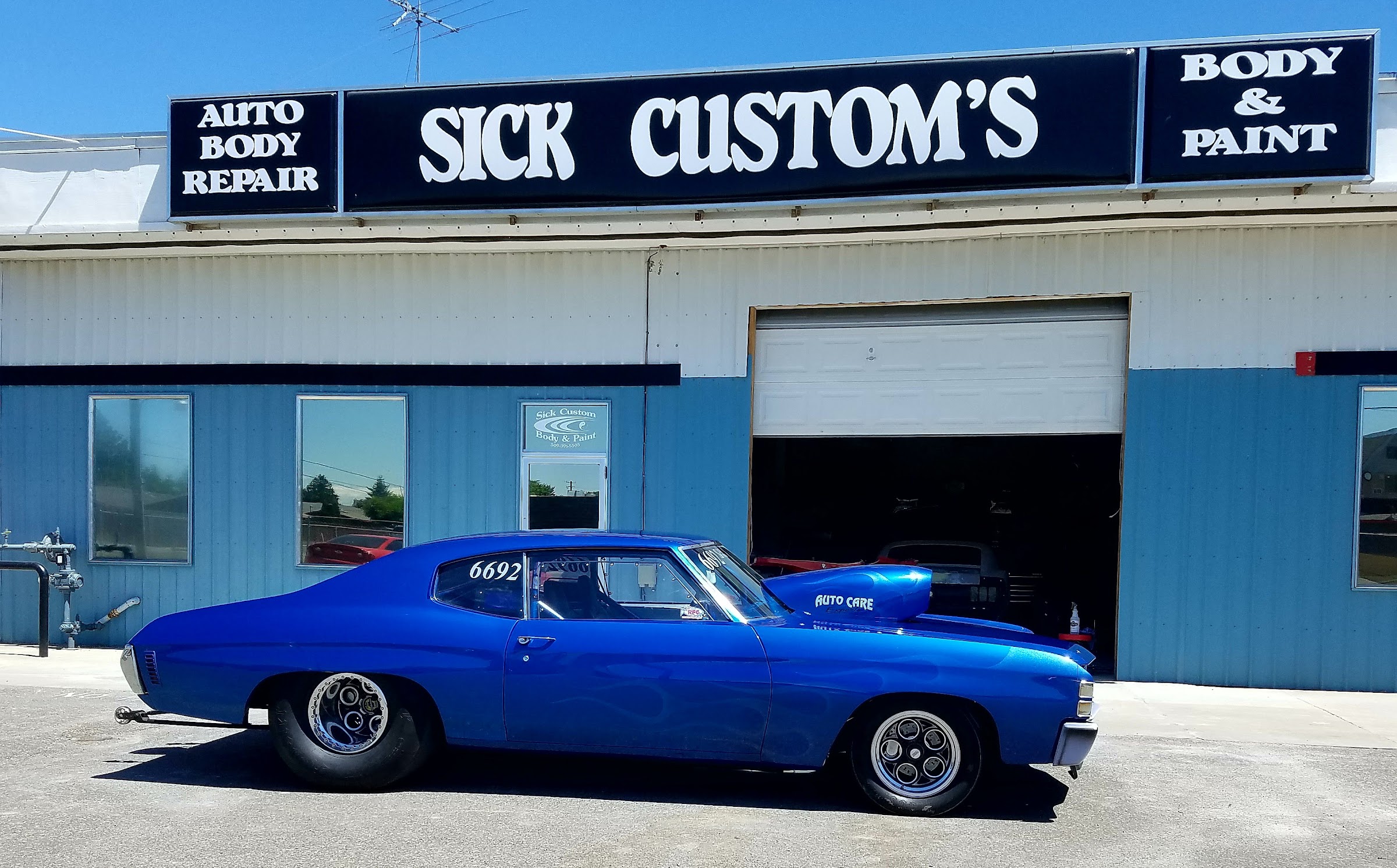 A blue classic muscle car outside Sick Custom Collision Repair